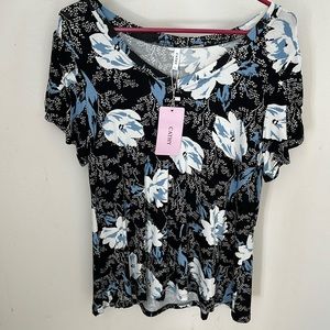 New with tags. Black with white flowers and light blue through out it.